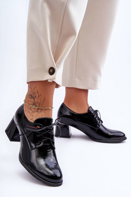 Stivaletti laccati con tacco in...