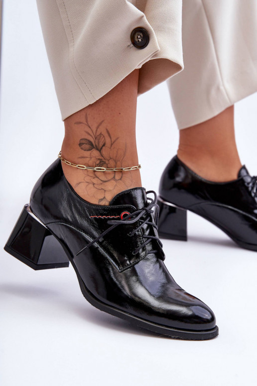 Stivaletti laccati con tacco in...