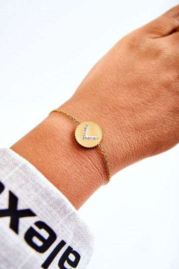 Bracciale da donna con ornamenti e occhi zirconi di colore oro 2