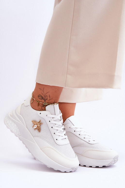 Scarpe sportive lucide con ornamenti in colore bianco Seneca Scarpe sportive lucide con ornamenti in colore bianco Seneca