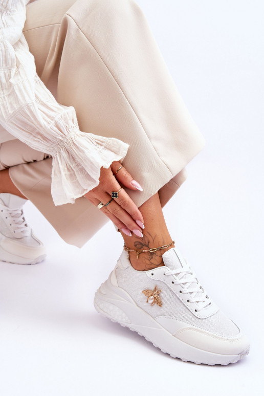 Scarpe sportive lucide con ornamenti in colore bianco Seneca Scarpe sportive lucide con ornamenti in colore bianco Seneca