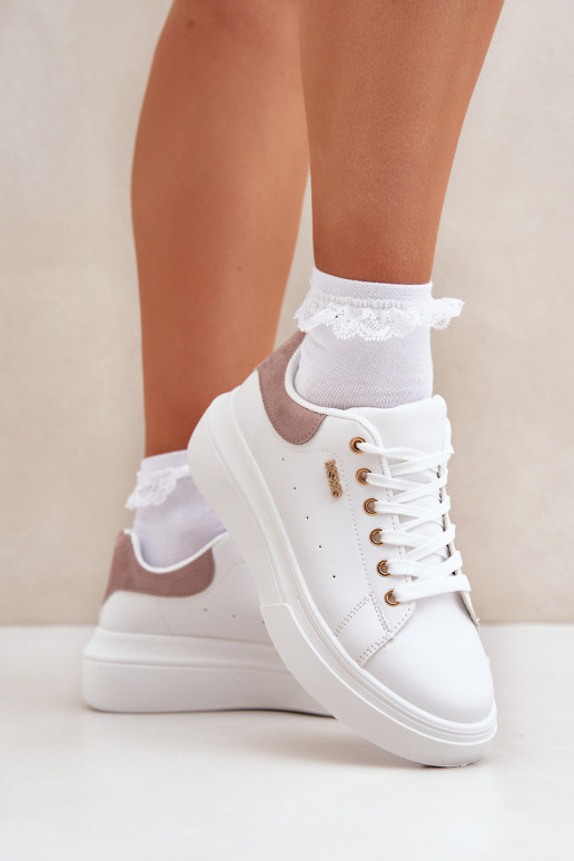 Scarpe modello sneakers Femminile con una piattaforma in ecopelle Colore bianco Lelandine Scarpe modello sneakers Femminile con una piattaforma in ecopelle Colore bianco Lelandine