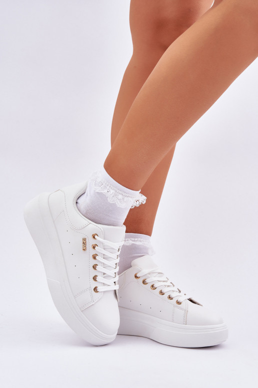 Scarpe modello sneakers Femminile con una piattaforma in ecopelle Colore bianco Lelandine Scarpe modello sneakers Femminile con una piattaforma in ecopelle Colore bianco Lelandine