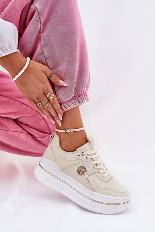 Femminile scarpe da ginnastica con una piattaforma beige Caldeno