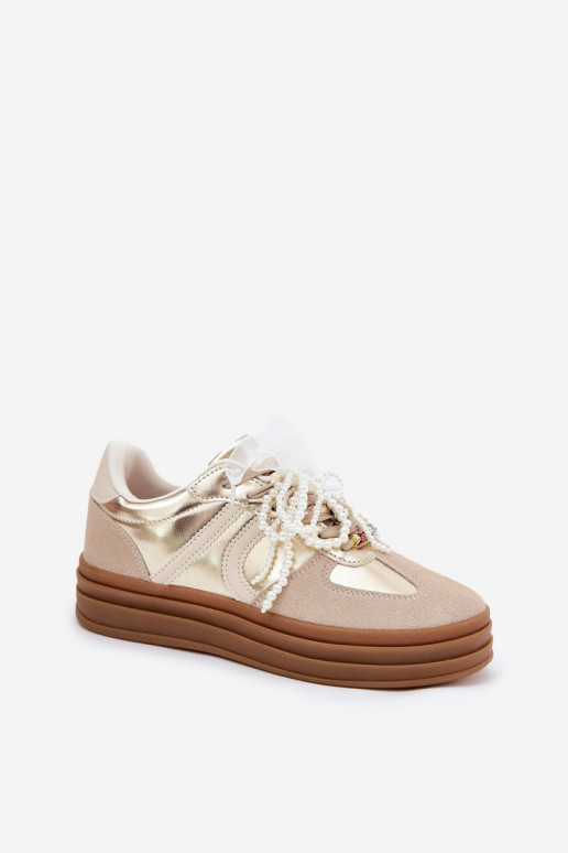 Scarpe modello sneakers Femminile con una piattaforma con bellissimi dettagli beige-colore dorato Vinness
